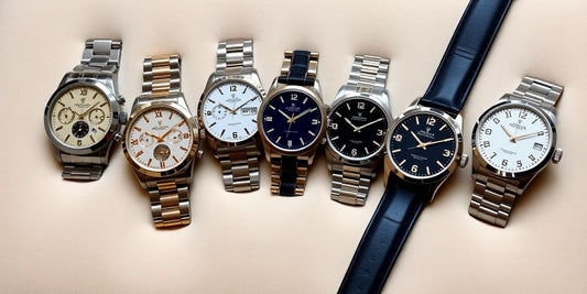 Elegant luxury watches on a soft velvet surface.